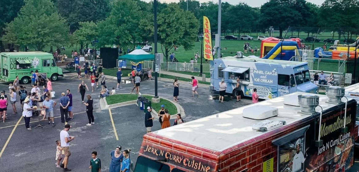 A colorful food truck serving local residents at a sunny Sarasota outdoor market, representing the nomadic kitchen culture of Southwest Florida